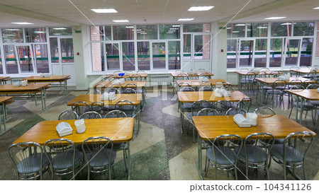 Chairs and tables. The dining hall in school is quarantined, isolation. 104341126