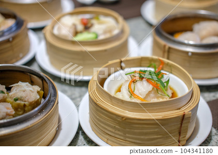 Various Dimsum in the stream basket on the table Various Dimsum in the stream basket on the table 104341180