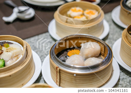 Various Dimsum in the stream basket on the table Various Dimsum in the stream basket on the table 104341181