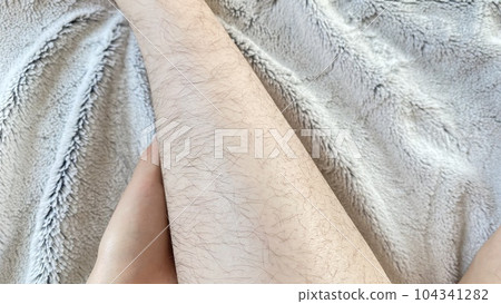 Close-up of hairy woman's shin Close-up of hairy woman's shin 104341282