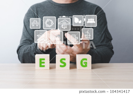 businessman use technology to reduce co2. the idea for environmentally conscious business, climate change, ecology, friendly environment investment, ESG for Environment Social and Governance 104341417
