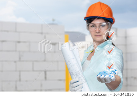 Shows the work done on the background of the construction site. 104341830