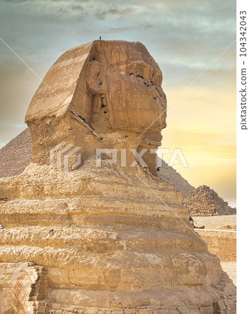 sphinx of egypt captured from a profile on a cloudy day sphinx of egypt captured from a profile on a cloudy day 104342043
