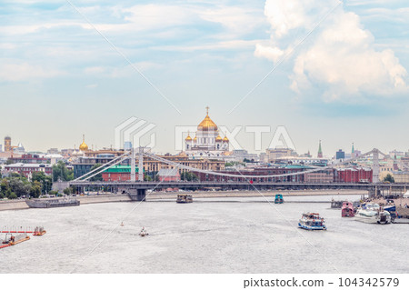 Cruise ship sails on the Moscow river in Moscow city center, popular place for walking. Cruise ship sails on the Moscow river in Moscow city center, popular place for walking. 104342579
