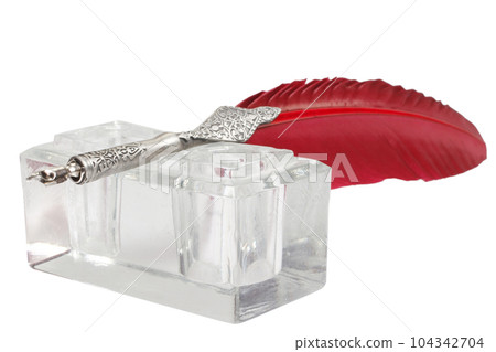 Old red fountain pen with inkwell on white background 104342704