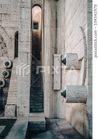 Carved steps staircase inside the arch modern architecture concept photo. 104342978