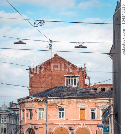 Old damaged architecture in Kharkiv in spring. Cityscape photo in Ukraine. 104343139
