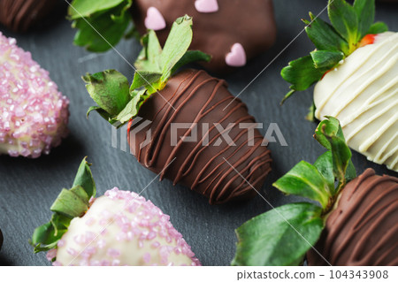 Gourmet chocolate covered strawberries on the dark background 104343908