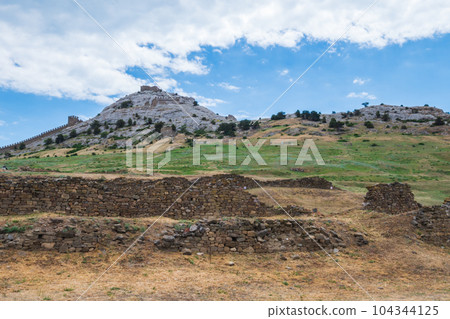 A fortress with towers on a rock. A fortress with towers on a rock. 104344125
