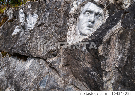 Faces carved in stone by a master, sculptor Faces carved in stone by a master, sculptor 104344233