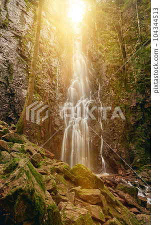 Burgbach Waterfall in coniferous forest falls over granite rocks into the valley near Bad Rippoldsau-Schapbach, Black Forest, Germany. Amazing beautiful natural waterfall called burgbachwasserfall of Burgbach Waterfall in coniferous forest falls over granite rocks into the valley near Bad Rippoldsau-Schapbach, Black Forest, Germany. Amazing beautiful natural waterfall called burgbachwasserfall of 104344513