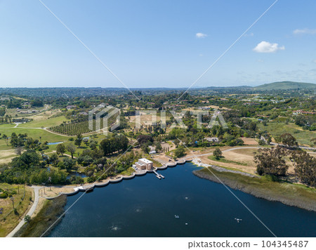 Aerial view over water reservoir and a large dam that holds water. Rancho Santa Fe in San Diego 104345487