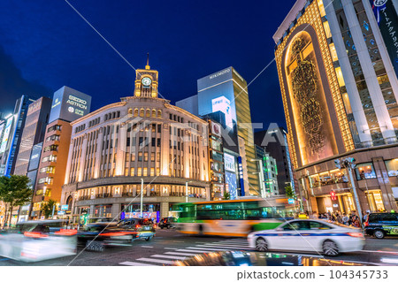 Tokyo cityscape in Japan Ginza where summer solstice and mask release are progressing and crowded. Sunset at 19:00 = June 21 104345733