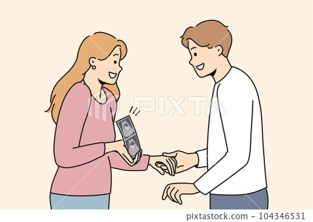 Pregnant woman holding ultrasound picture with baby showing future kiddy to happy father 104346531