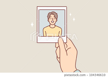 Photo of teenager boy in hand of father or mother for concept of nostalgia for times gone by 104346610