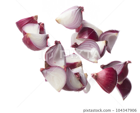 Shallots fall fly in mid air, red fresh vegetable spice shallots onion floating. Organic fresh herbal shallots root head cut chop slice. White background isolated freeze motion high speed shutter Shallots fall fly in mid air, red fresh vegetable spice shallots onion floating. Organic fresh herbal shallots root head cut chop slice. White background isolated freeze motion high speed shutter 104347906