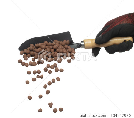 Clay Drainage big size ball pour fall down, explosion in shovel hand. Clay Drainage ball splash in shape form line explosion. White background isolated high speed shutter freeze motion Clay Drainage big size ball pour fall down, explosion in shovel hand. Clay Drainage ball splash in shape form line explosion. White background isolated high speed shutter freeze motion 104347920