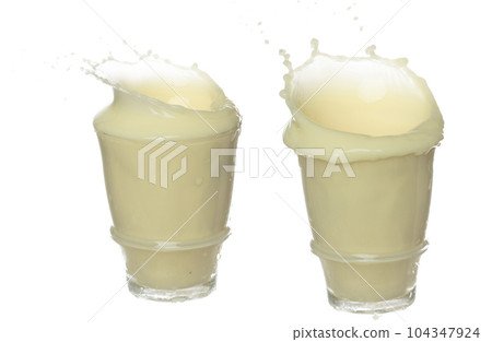 Tofu Soybean soymilk pour fall down. Soybean milk or cosmetic cream moisturizer spill splash in shape glass bowl as paint color. White background isolated high speed shutter freeze motion 104347924
