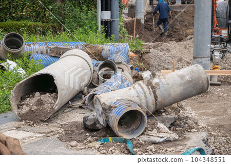 Old piping removed during civil engineering work 104348551