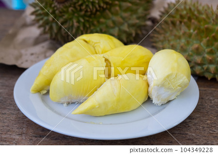 Durian the King of Fruits on White Plate, Ripe and Fresh Golden Durian with Tasty Sweet Fruit 104349228