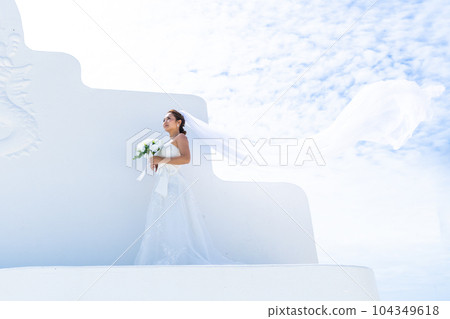 Pre-shoot of the bride with her wedding dress veil dancing Pre-shoot of the bride with her wedding dress veil dancing 104349618