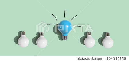 One out unique idea light bulb - Flat lay One out unique idea light bulb - Flat lay 104350156