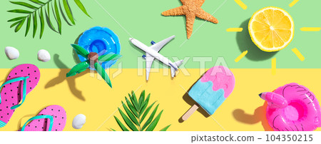 Summer concept with a airplane, a popsicle, flip flops and lemon sunshine 104350215