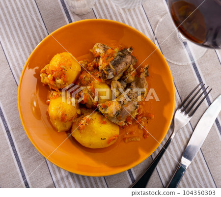 Appetizing stewed rabbit with potato Appetizing stewed rabbit with potato 104350303