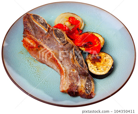 Delicious uruguayan style churrasco steak served with eggplant and pimento pepper Delicious uruguayan style churrasco steak served with eggplant and pimento pepper 104350411