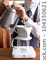barista pouring hot water 104350621