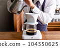 Barista who drinks coffee 104350625