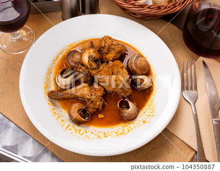 Stewed pork and potato pieces served in a plate 104350887