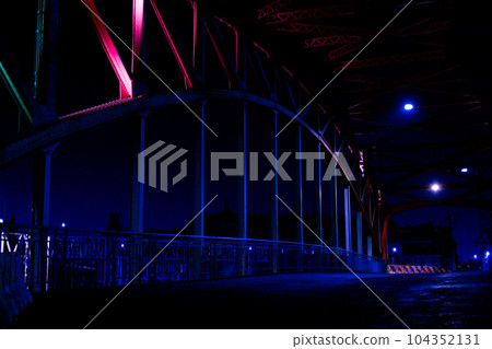 Empty Bridge Street line lights. Night highway city. Long exposure photograph night road. Background wallpaper defocused Empty Bridge Street line lights. Night highway city. Long exposure photograph night road. Background wallpaper defocused 104352131