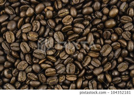 Close-up brown coffee beans background. Close-up brown coffee beans background. 104352181