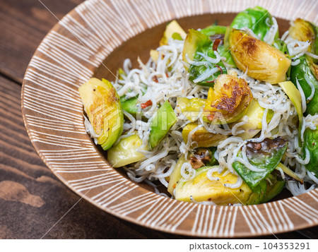 Stir-fried brussels sprouts and shirasu with garlic and olive oil. Stir-fried brussels sprouts and shirasu with garlic and olive oil. 104353291