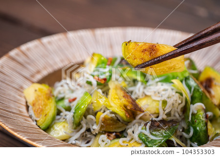 Stir-fried brussels sprouts and shirasu with garlic and olive oil. Stir-fried brussels sprouts and shirasu with garlic and olive oil. 104353303