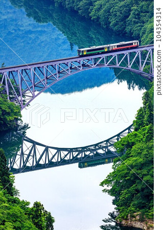 Tadami Line Train crossing the Daiichi Tadami River Bridge in spring (Mishima Town, Fukushima Prefecture, late May early morning) Tadami Line Train crossing the Daiichi Tadami River Bridge in spring (Mishima Town, Fukushima Prefecture, late May early morning) 104354314