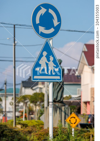 Roundabout signs, crosswalk signs, and roundabout signs at roundabouts 104355003