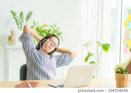 Asia woman touching massage stiff neck after sedentary computer 104358046