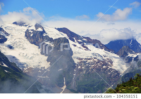The Caucasus Mountains. Mountain peaks in summer. 104358151