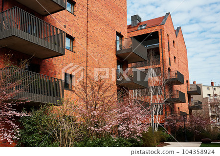Modern residential complex in Gdansk, Poland. Living house facade with balconies. Apartment building. Mortgage in real estate 104358924
