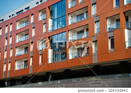 Modern residential complex in Gdansk, Poland. Living house facade with balconies. Apartment building. Mortgage in real estate Modern residential complex in Gdansk, Poland. Living house facade with balconies. Apartment building. Mortgage in real estate 104358941