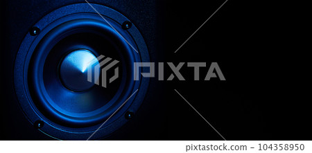 Multimedia acoustic sound speakers with blue neon lighting. Sound audio system on dark background with copy space Multimedia acoustic sound speakers with blue neon lighting. Sound audio system on dark background with copy space 104358950