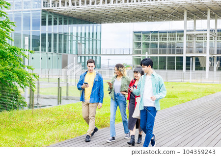 Multinational student group walking on campus Multinational student group walking on campus 104359243