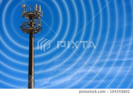Telecommunications Tower with Antennas Against a Blue Sky 104359802
