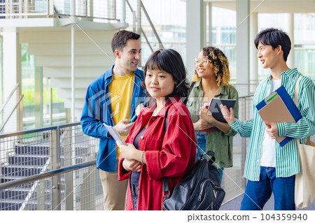 Multinational youth group having a conversation in the lobby 104359940