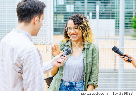 Foreign women being interviewed 104359988