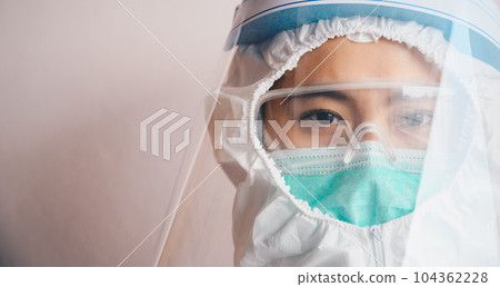 Cropped shot of confidence healthcare worker while wearing PPE suit before working in hospital during Covid-19 pandemic. 104362228