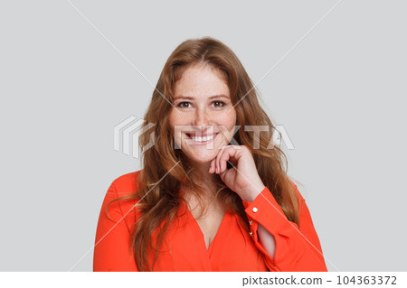 Perfect positive friendly smiling woman with ginger curly hair on white studio wall background Perfect positive friendly smiling woman with ginger curly hair on white studio wall background 104363372