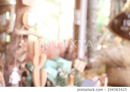 Abstract blurred background of souvenir retail shop show vintage decorative  product made from wood. 104363425